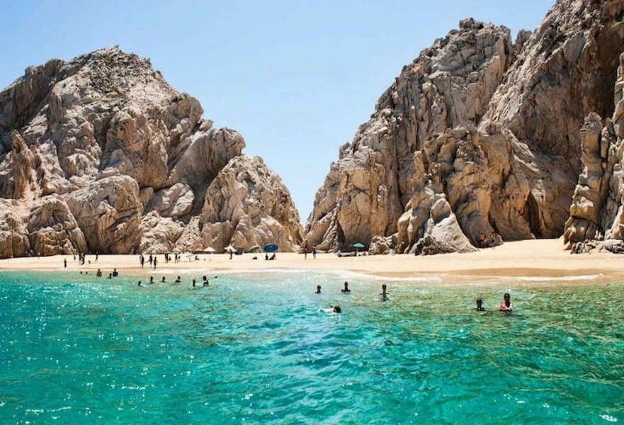 People swimming at Lovers Beach